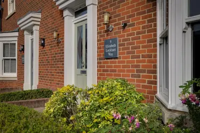 a brick house with a sign that reads private house at Elizabeth Townhouse Braintree in Bocking Churchstreet