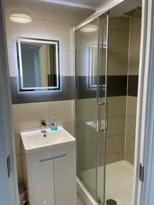 a bathroom with a sink and a shower at Modern 1 Bedroom Holiday Apartment in Southminster in Southminster