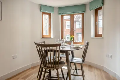 a dining room with a table and chairs at 3 Bed in Aldeburgh oc-16afaw in Aldeburgh