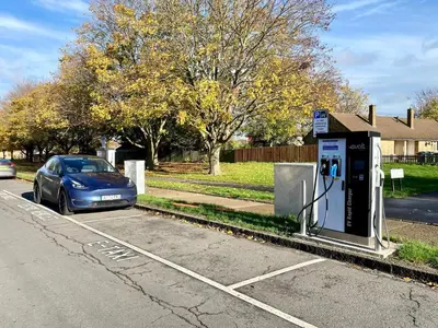 a car parked next to a payphone on the side of a street at Rest on Super-King Bed under The Starry Night in Chesterton