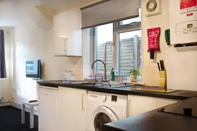 a kitchen with a sink and a washing machine at Host & Stay - Clacton Coastal Hideaway in Clacton-on-Sea