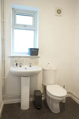 a bathroom with a toilet and a sink and a window at Host & Stay - Clacton Coastal Hideaway in Clacton-on-Sea