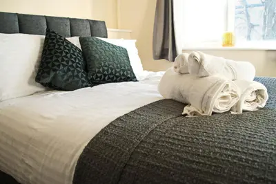 a bed with a towel on the end of it at Host & Stay - Clacton Coastal Hideaway in Clacton-on-Sea
