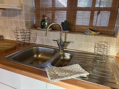 a stainless steel sink in a kitchen at Two Storey Annex in Cottenham