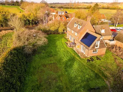 an aerial view of a house with a large yard at Unique 5BD Farm House Perfect for Relaxing in Ipswich