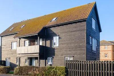a large house with a brown roof at The Quarter Deck in Aldeburgh