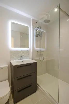 a bathroom with a sink and a shower at Three Tuns - Garden Suite 1 in Wickham Market