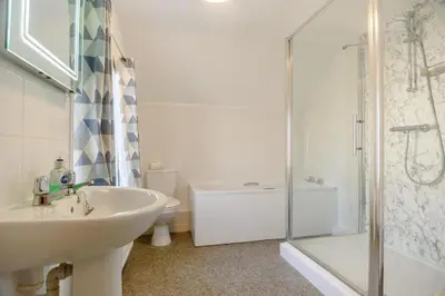 a bathroom with a sink and a shower and a toilet at 4 Bed in Aldeburgh oc-al123 in Aldeburgh