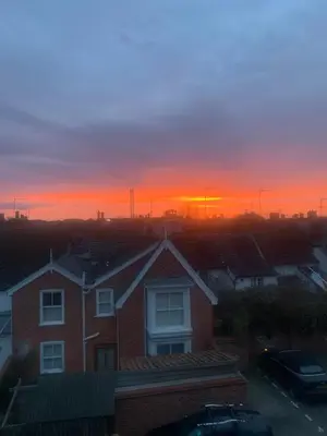 a house with a sunset in the background at Stylish 3 bedroom townhouse for 5 guests, set in the medieval grid with off street parking in Bury Saint Edmunds