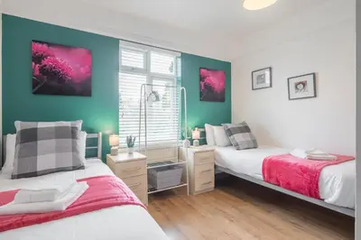a bedroom with two beds and a window at The Modern Cambridge Studio 6 in Cambridge