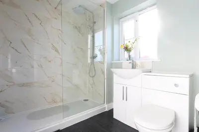 a bathroom with a shower and a toilet and a sink at Ipswich-Luxury-Self Catering-Town Centre-Parking in Ipswich