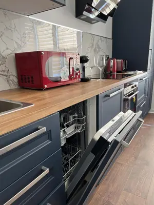 a kitchen with a red appliance on a counter at Modern accomodation in Westcliff-On-Sea in Westcliff On Sea