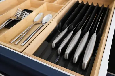 a wooden tray with utensils in a drawer at Modern accomodation in Westcliff-On-Sea in Westcliff On Sea
