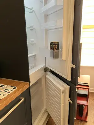 a refrigerator with its door open in a kitchen at Modern accomodation in Westcliff-On-Sea in Westcliff On Sea