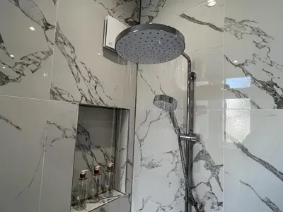 a bathroom with a shower and a mirror at Modern accomodation in Westcliff-On-Sea in Westcliff On Sea