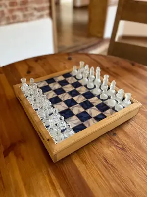 a chess board on a wooden table at Charming Norfolk Barn Conversion in Barnham Broom in Norwich