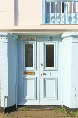 a blue door with a sign on top of it at 3 Bed in Aldeburgh oc-marg in Aldeburgh