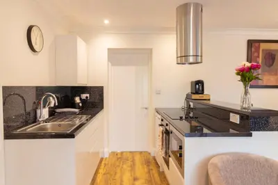 a kitchen with a sink and a counter top at The Lodge at Highlands in Everton