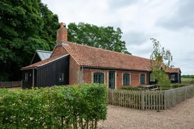 an old brick house with a fence in front of it at 3 Bed in Snape oc-1wadd in Snape