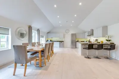 a kitchen and dining room with a table and chairs at 3 Bed in Snape oc-1wadd in Snape