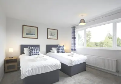 a bedroom with two beds and a window at 3 Bed in Aldeburgh oc-10nw in Aldeburgh