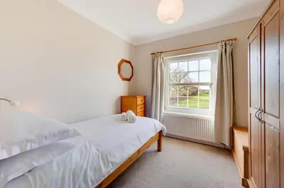a bedroom with a bed and a window at 3 Bed in Belchamp Otten oc-2mf in Belchamp Otten