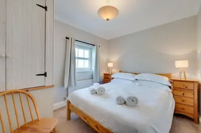 a bedroom with a bed with towels on it at 3 Bed in Belchamp Otten oc-2mf in Belchamp Otten