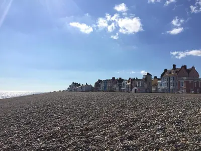 a group of houses on a rocky beach at 2 Bed in Aldeburgh oc-3al in Aldeburgh