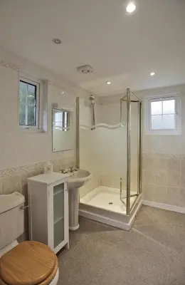a bathroom with a shower and a sink and a toilet at 4 Bed in Thorpeness oc-bays in Thorpeness