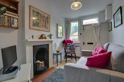 a living room with a couch and a fireplace at 2 Bed in Long Melford oc-9ws in Long Melford