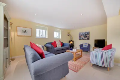 a living room with two couches and a tv at 6 Bed in Knodishall oc-bil in Aldringham
