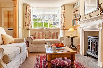 a living room with a couch and a fireplace at 2 Bed in Yoxford oc-c27253 in Wickham Market