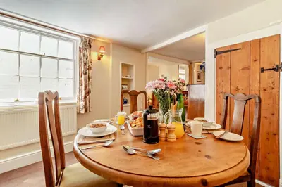 a wooden table in a kitchen with a dining room at 2 Bed in Yoxford oc-c27253 in Wickham Market