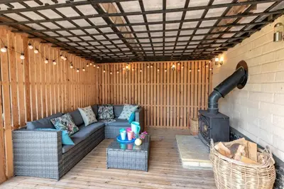 a outdoor patio with a couch and a stove at 2 Bed in Rumburgh oc-dgf in Rumburgh