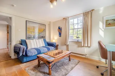 a living room with a blue couch and a coffee table at 3 Bed in Westleton Saxmundham oc-est in Westleton