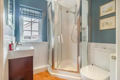 a bathroom with a shower and a sink and a toilet at 3 Bed in Westleton Saxmundham oc-est in Westleton