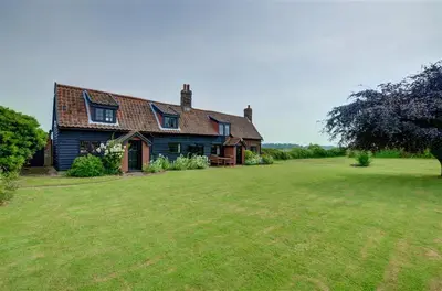 a house with a large grass field in front of it at 3 Bed in Hemley oc-g91 in Hemley