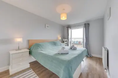 a bedroom with a bed with two pillows on it at 3 Bed in Felixstowe oc-fel in Felixstowe