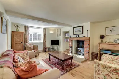 a living room with a couch and a fireplace at 2 Bed in Orford oc-sflis in Orford