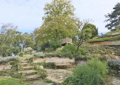 a bench in the middle of a garden at 2 Bed in Ufford oc-sfmcu in Ufford
