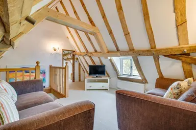 a living room with two couches and a tv at 5 Bed in Finningham oc-obhf in Finningham