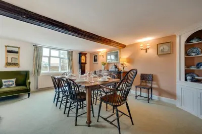 a dining room with a table and chairs at 4 Bed in Orford oc-obh2 in Orford
