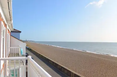a view of the beach from the balcony of a house at 3 Bed in Aldeburgh oc-reg in Aldeburgh