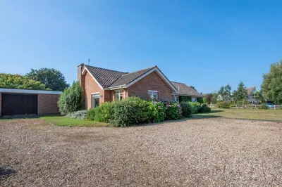 a brick house with a gravel driveway at 3 Bed in Aldeburgh oc-spr in Aldeburgh