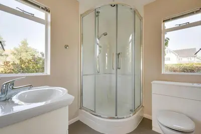 a bathroom with a shower and a toilet and a sink at 3 Bed in Aldeburgh oc-spr in Aldeburgh