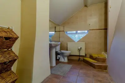 a bathroom with a toilet and a sink at 5 Bed in Metfield oc-stfarm in Metfield