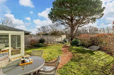 a patio with a table and chairs in a yard at 4 Bed in Westleton oc-s27303 in Westleton
