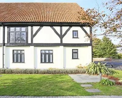 a white house with a red roof at 4 Bed in Thorpeness oc-cho in Thorpeness