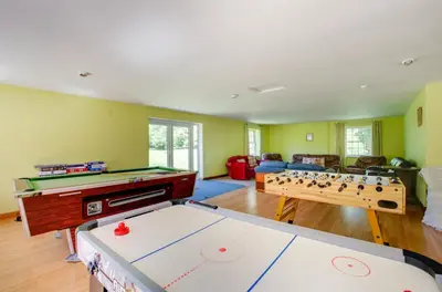 a living room with a pool table and ping pong ball at 13 Bed in Tattingstone oc-tat26 in Tattingstone