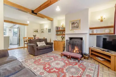 a living room with a couch and a fireplace at 3 Bed in Woodbridge oc-h23 in Woodbridge